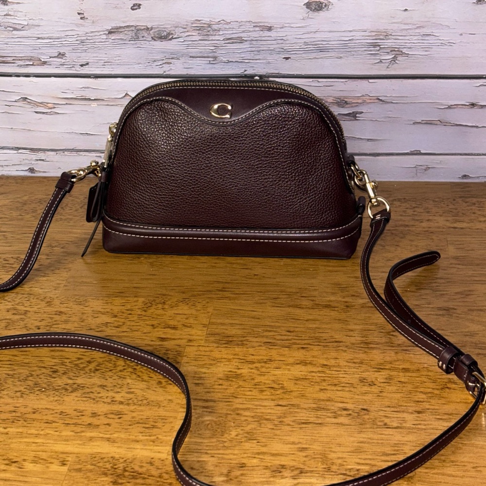 Coach Ivie oxblood leather crossbody bag.
